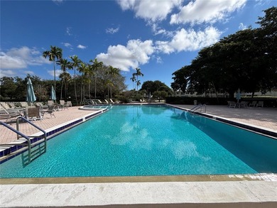 Welcome to resort-style living in this beautifully maintained on Wynmoor Golf Course in Florida - for sale on GolfHomes.com, golf home, golf lot