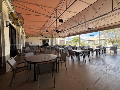 Welcome to resort-style living in this beautifully maintained on Wynmoor Golf Course in Florida - for sale on GolfHomes.com, golf home, golf lot