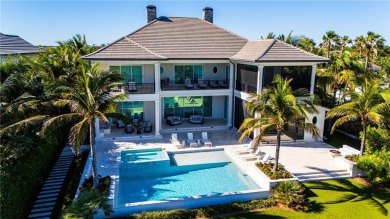 Gated West Indies inspired 5 BD, 2 story smart home with 5.4 BA on Moorings Golf Club in Florida - for sale on GolfHomes.com, golf home, golf lot