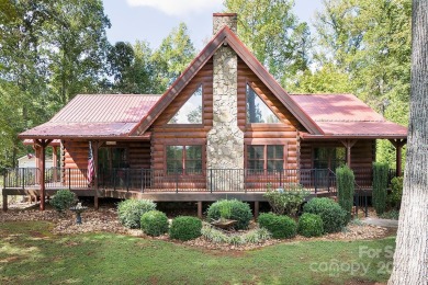 Discover this exceptional 1.5-story log home nestled in a on Lake Louise Golf Club in North Carolina - for sale on GolfHomes.com, golf home, golf lot