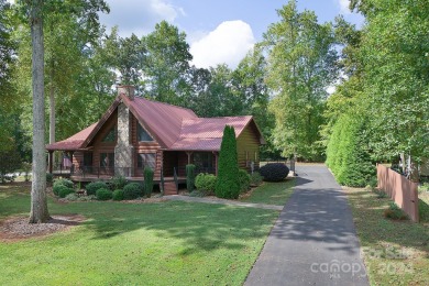 Discover this exceptional 1.5-story log home nestled in a on Lake Louise Golf Club in North Carolina - for sale on GolfHomes.com, golf home, golf lot