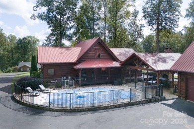 Discover this exceptional 1.5-story log home nestled in a on Lake Louise Golf Club in North Carolina - for sale on GolfHomes.com, golf home, golf lot