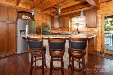 Discover this exceptional 1.5-story log home nestled in a on Lake Louise Golf Club in North Carolina - for sale on GolfHomes.com, golf home, golf lot