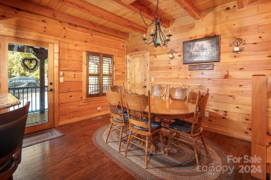 Discover this exceptional 1.5-story log home nestled in a on Lake Louise Golf Club in North Carolina - for sale on GolfHomes.com, golf home, golf lot