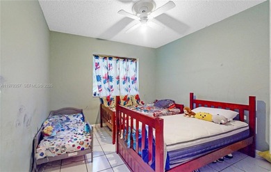 This home features a spacious layout with tile flooring on Palmetto Golf Course in Florida - for sale on GolfHomes.com, golf home, golf lot