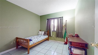 This home features a spacious layout with tile flooring on Palmetto Golf Course in Florida - for sale on GolfHomes.com, golf home, golf lot