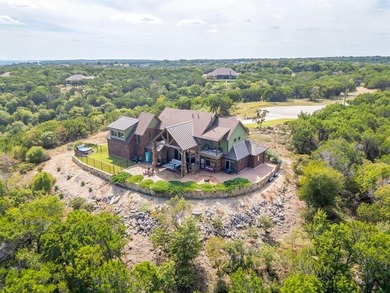 Step into the extraordinary at 8225 Scotscraig Ct, a masterfully on The Retreat in Texas - for sale on GolfHomes.com, golf home, golf lot