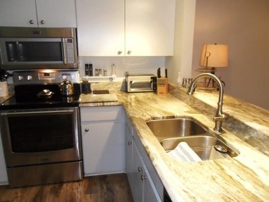 On the Golf course, spacious Turn Key two bed two bath condo on Meadowood Golf and Tennis Club in Florida - for sale on GolfHomes.com, golf home, golf lot