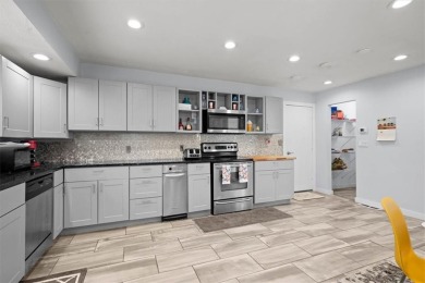 This gorgeous California Split Level home, designed and lived in on Lawrence Country Club in Kansas - for sale on GolfHomes.com, golf home, golf lot