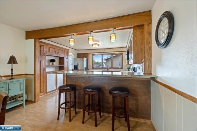 This beautifully maintained 4-bedroom, 3-bathroom home is on Virginia Golf Course in Minnesota - for sale on GolfHomes.com, golf home, golf lot