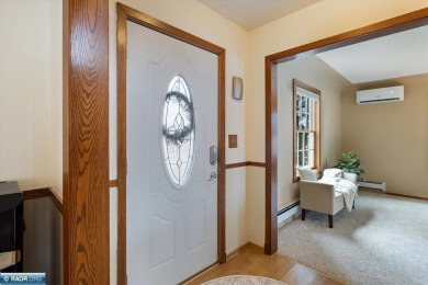 This beautifully maintained 4-bedroom, 3-bathroom home is on Virginia Golf Course in Minnesota - for sale on GolfHomes.com, golf home, golf lot