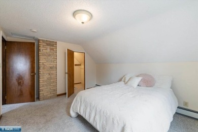 This beautifully maintained 4-bedroom, 3-bathroom home is on Virginia Golf Course in Minnesota - for sale on GolfHomes.com, golf home, golf lot