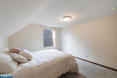 This beautifully maintained 4-bedroom, 3-bathroom home is on Virginia Golf Course in Minnesota - for sale on GolfHomes.com, golf home, golf lot