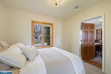This beautifully maintained 4-bedroom, 3-bathroom home is on Virginia Golf Course in Minnesota - for sale on GolfHomes.com, golf home, golf lot