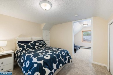 This beautifully maintained 4-bedroom, 3-bathroom home is on Virginia Golf Course in Minnesota - for sale on GolfHomes.com, golf home, golf lot