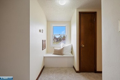 This beautifully maintained 4-bedroom, 3-bathroom home is on Virginia Golf Course in Minnesota - for sale on GolfHomes.com, golf home, golf lot