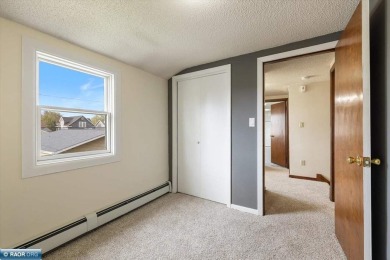 This beautifully maintained 4-bedroom, 3-bathroom home is on Virginia Golf Course in Minnesota - for sale on GolfHomes.com, golf home, golf lot