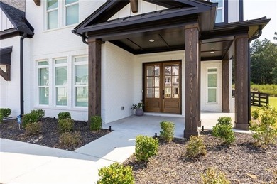 Welcome home to this executive home built by the Toll Brothers on Capital City Club Crabapple in Georgia - for sale on GolfHomes.com, golf home, golf lot