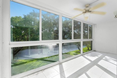 Best priced unit with impact windows! Stunning waterfront 2 on Wynmoor Golf Course in Florida - for sale on GolfHomes.com, golf home, golf lot