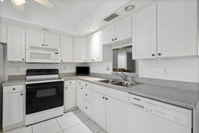 Best priced unit with impact windows! Stunning waterfront 2 on Wynmoor Golf Course in Florida - for sale on GolfHomes.com, golf home, golf lot