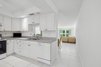 Best priced unit with impact windows! Stunning waterfront 2 on Wynmoor Golf Course in Florida - for sale on GolfHomes.com, golf home, golf lot