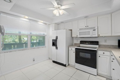 Best priced unit with impact windows! Stunning waterfront 2 on Wynmoor Golf Course in Florida - for sale on GolfHomes.com, golf home, golf lot