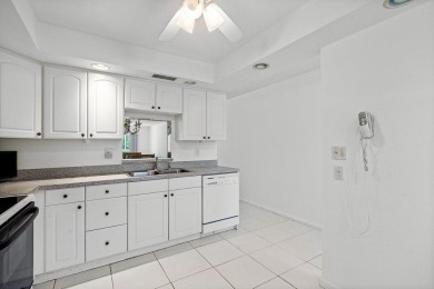 Best priced unit with impact windows! Stunning waterfront 2 on Wynmoor Golf Course in Florida - for sale on GolfHomes.com, golf home, golf lot
