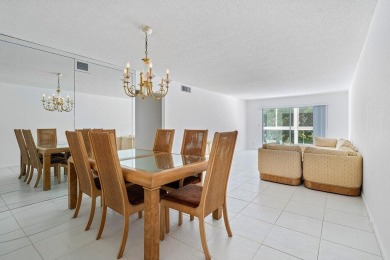 Best priced unit with impact windows! Stunning waterfront 2 on Wynmoor Golf Course in Florida - for sale on GolfHomes.com, golf home, golf lot