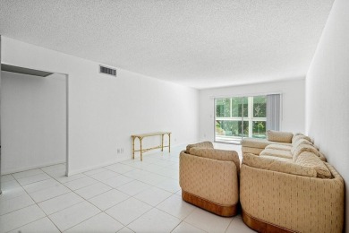 Best priced unit with impact windows! Stunning waterfront 2 on Wynmoor Golf Course in Florida - for sale on GolfHomes.com, golf home, golf lot