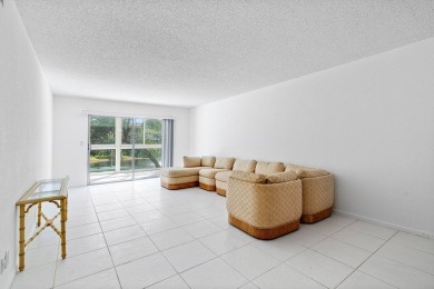 Best priced unit with impact windows! Stunning waterfront 2 on Wynmoor Golf Course in Florida - for sale on GolfHomes.com, golf home, golf lot