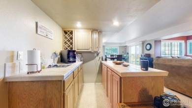Enjoy maintenance-free living in this 4bd/3ba/OS 2-gar/2940sf on Ptarmigan Golf Course in Colorado - for sale on GolfHomes.com, golf home, golf lot