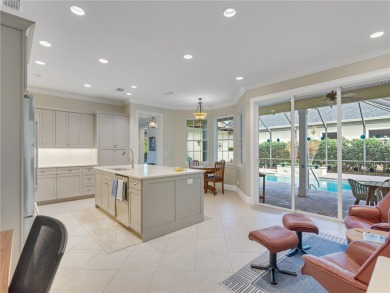 This courtyard pool home is nestled on a lush golf course on Indian River Club in Florida - for sale on GolfHomes.com, golf home, golf lot