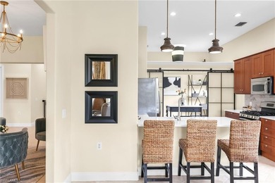 Gorgeous, spacious end unit with views of trees and water on The Rookery At Marco in Florida - for sale on GolfHomes.com, golf home, golf lot