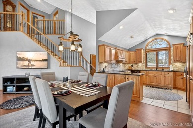 This stunning lakefront home in Four Seasons offers 75 feet of on Seasons Ridge At Four Seasons in Missouri - for sale on GolfHomes.com, golf home, golf lot