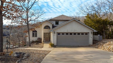 This stunning lakefront home in Four Seasons offers 75 feet of on Seasons Ridge At Four Seasons in Missouri - for sale on GolfHomes.com, golf home, golf lot