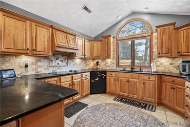 This stunning lakefront home in Four Seasons offers 75 feet of on Seasons Ridge At Four Seasons in Missouri - for sale on GolfHomes.com, golf home, golf lot