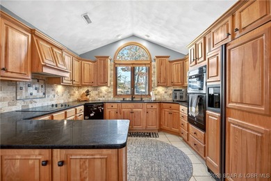 This stunning lakefront home in Four Seasons offers 75 feet of on Seasons Ridge At Four Seasons in Missouri - for sale on GolfHomes.com, golf home, golf lot