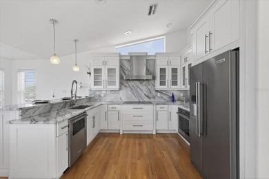 Experience elevated coastal living in this luxuriously updated on Gulf Harbors Golf Course in Florida - for sale on GolfHomes.com, golf home, golf lot