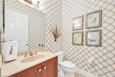 Gorgeous, spacious end unit with views of trees and water on The Rookery At Marco in Florida - for sale on GolfHomes.com, golf home, golf lot