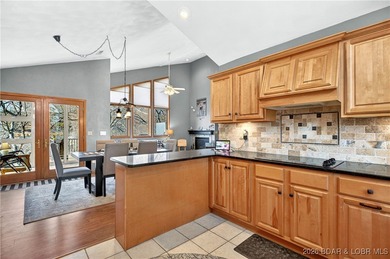 This stunning lakefront home in Four Seasons offers 75 feet of on Seasons Ridge At Four Seasons in Missouri - for sale on GolfHomes.com, golf home, golf lot