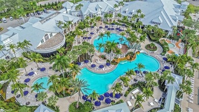 Gorgeous, spacious end unit with views of trees and water on The Rookery At Marco in Florida - for sale on GolfHomes.com, golf home, golf lot