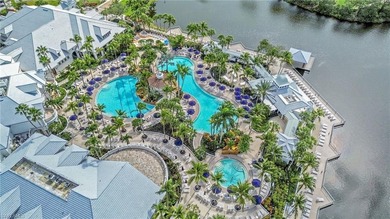 Gorgeous, spacious end unit with views of trees and water on The Rookery At Marco in Florida - for sale on GolfHomes.com, golf home, golf lot