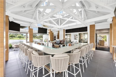 Gorgeous, spacious end unit with views of trees and water on The Rookery At Marco in Florida - for sale on GolfHomes.com, golf home, golf lot