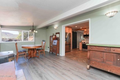 Charming house nestled among mature trees on a quiet street on Canyon Mesa Country Club in Arizona - for sale on GolfHomes.com, golf home, golf lot