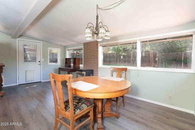 Charming house nestled among mature trees on a quiet street on Canyon Mesa Country Club in Arizona - for sale on GolfHomes.com, golf home, golf lot