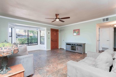 Charming house nestled among mature trees on a quiet street on Canyon Mesa Country Club in Arizona - for sale on GolfHomes.com, golf home, golf lot