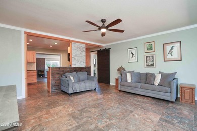 Charming house nestled among mature trees on a quiet street on Canyon Mesa Country Club in Arizona - for sale on GolfHomes.com, golf home, golf lot