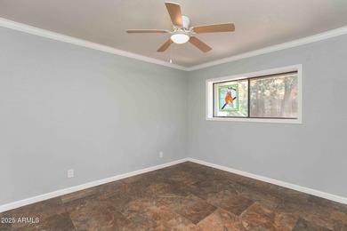 Charming house nestled among mature trees on a quiet street on Canyon Mesa Country Club in Arizona - for sale on GolfHomes.com, golf home, golf lot