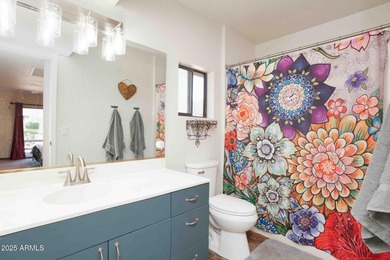 Charming house nestled among mature trees on a quiet street on Canyon Mesa Country Club in Arizona - for sale on GolfHomes.com, golf home, golf lot