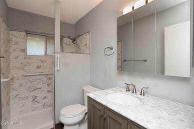 Charming house nestled among mature trees on a quiet street on Canyon Mesa Country Club in Arizona - for sale on GolfHomes.com, golf home, golf lot